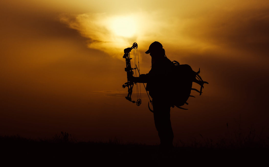 Hunter glassing across remote Alaska moose country while researching options for a guided Alaska or Yukon moose hunt.