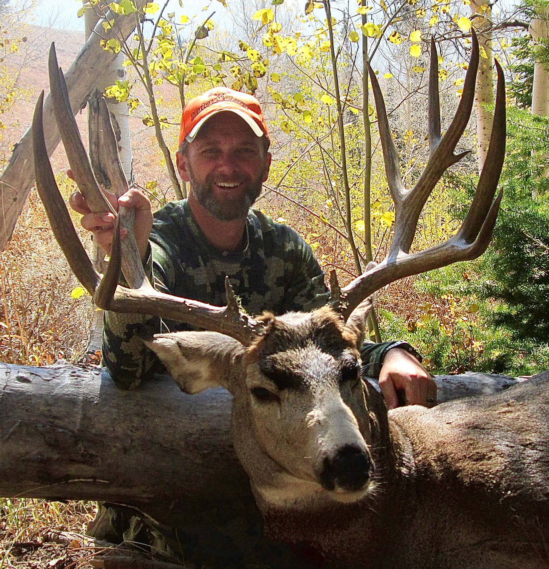 hunter studying terrain maps and planning scouting strategy