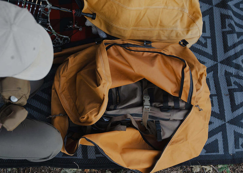 Canvas Cutter canvas duffel bag with camping accessories, showcasing modular outdoor gear designed to work together