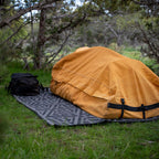 Barrier Mat set up at camp providing a clean surface for sleeping and organizing gear