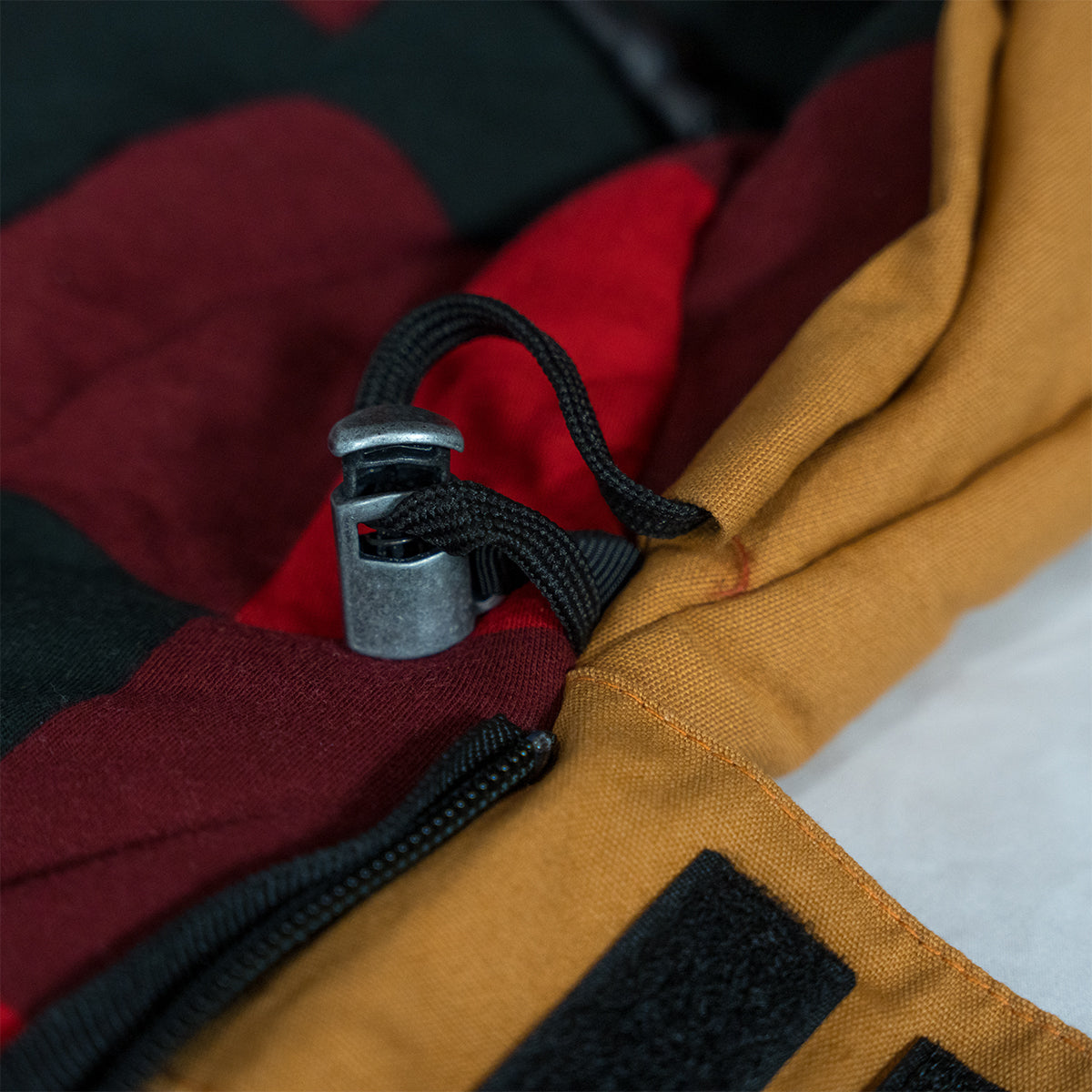 Close up of the Bunker Bag directional anti snag zipper for smooth operation and pull tabs