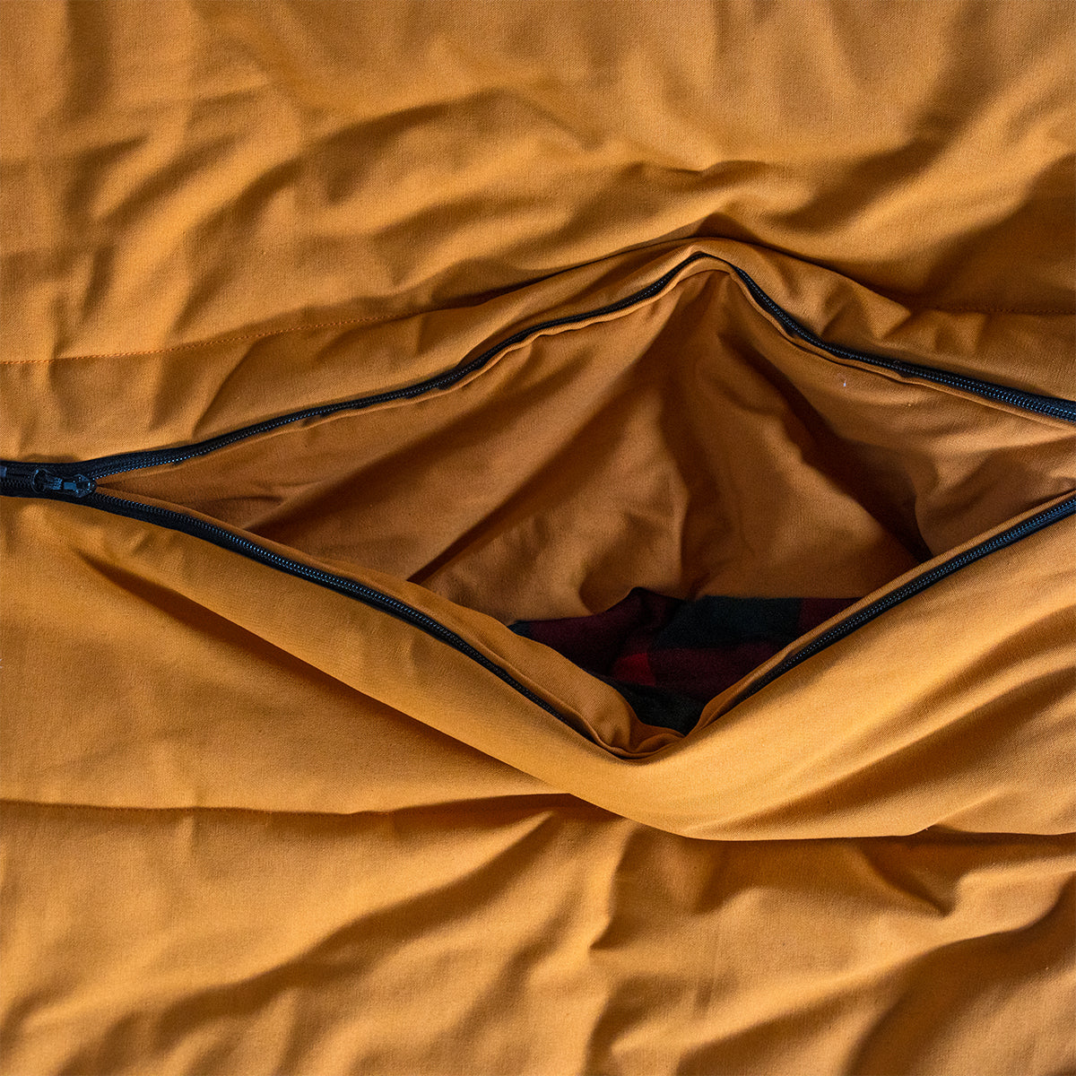 Interior access opening on the Bunker Bag showing quilted lining and easy entry design