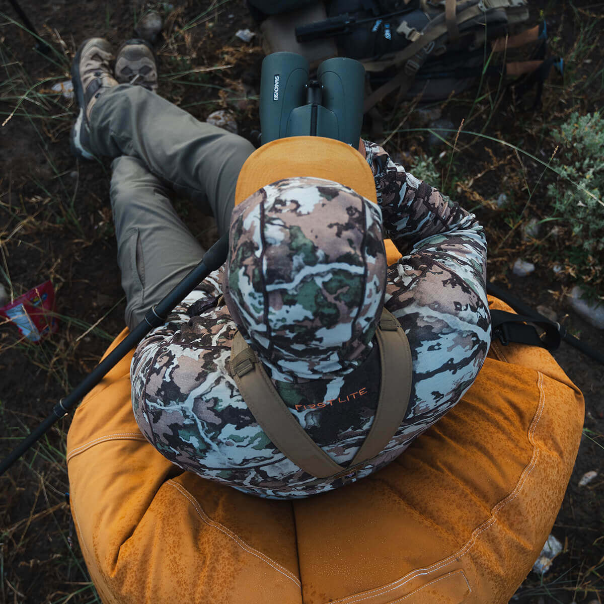 Person sitting on a Dirt Bag canvas bean bag outdoors
