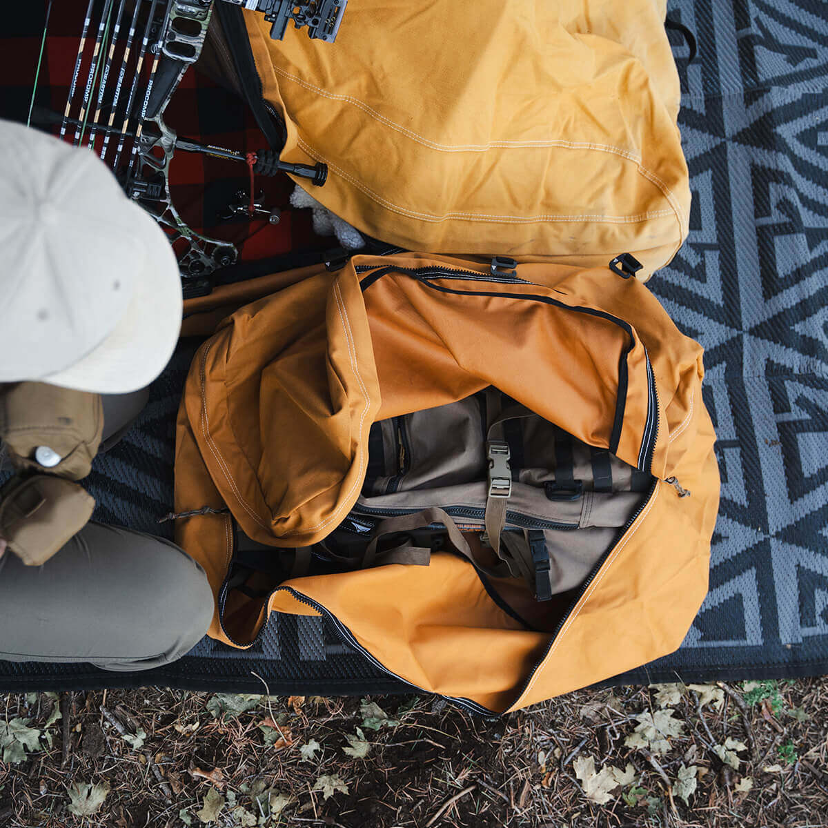 The Locker packed with camping gear and positioned next to a Canvas Cutter bedroll