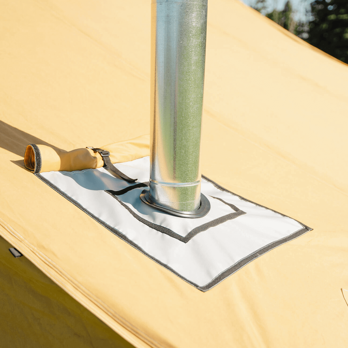 Close up of stove jack and flue installed on the Stronghold canvas wall tent
