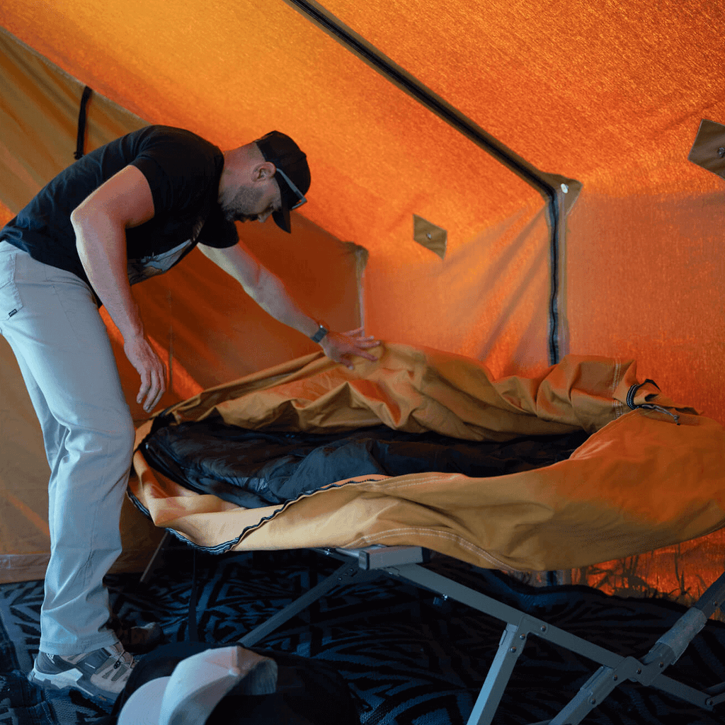 Setting up a bedroll inside the Stronghold modular wall tent