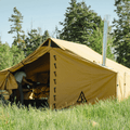 Canvas Cutter Stronghold modular wall tent set up in a grassy outdoor environment