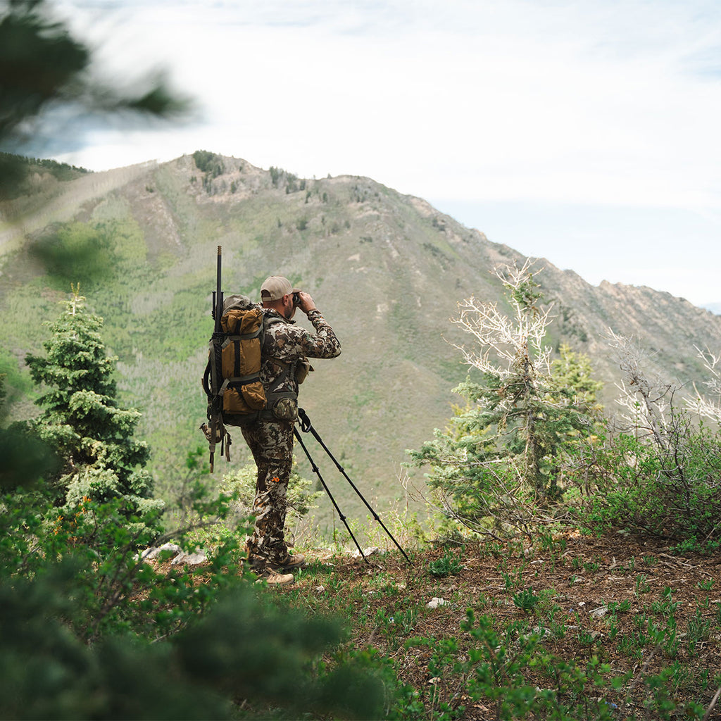 Hunter carrying a pack with the Summit Sleep System during backcountry travel
