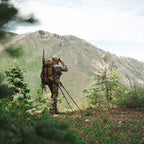 Hunter carrying a pack with the Summit Sleep System during backcountry travel