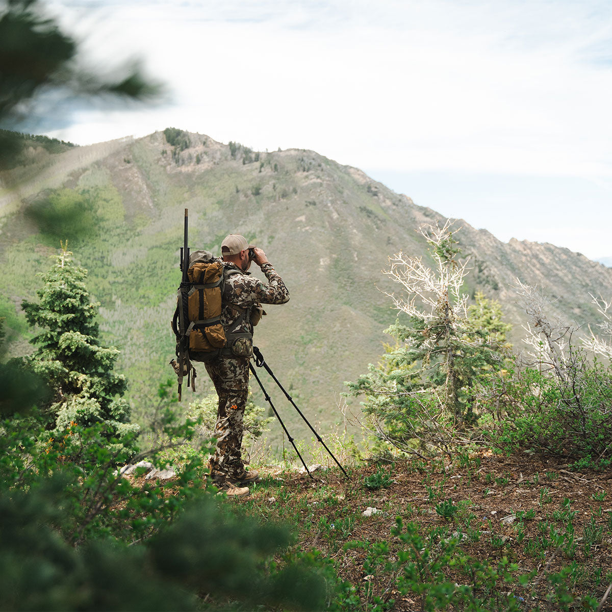 Hunter carrying a pack with the Summit Sleep System during backcountry travel