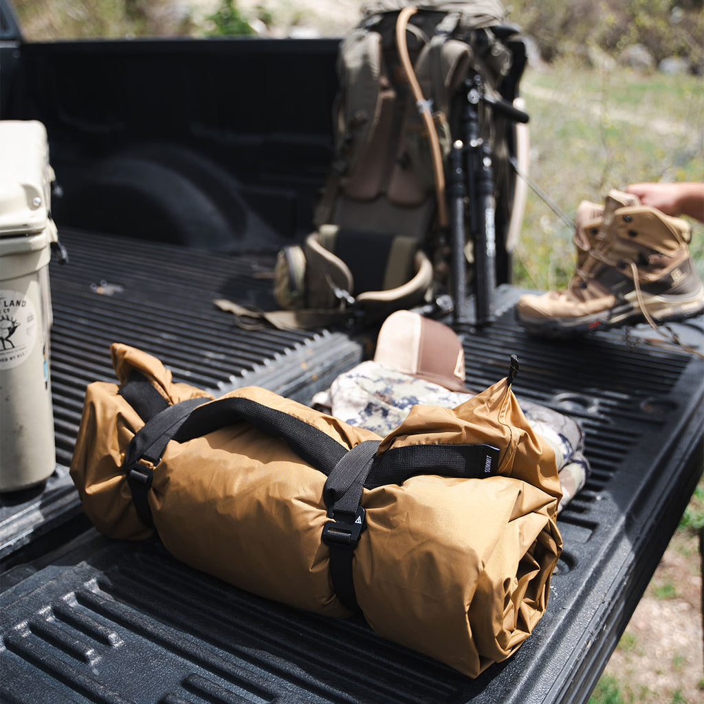 Summit Sleep System packed and stored in a truck bed ready for travel or hunting