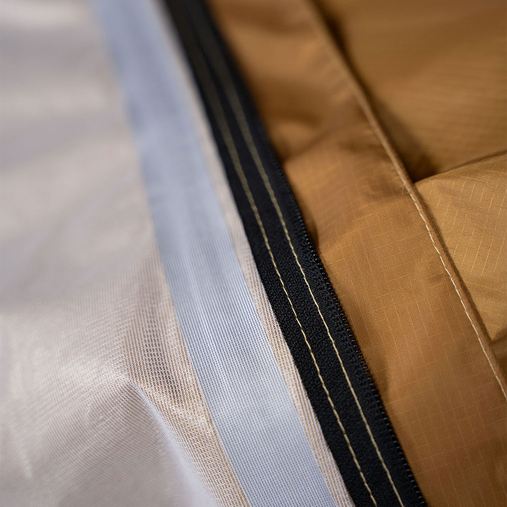 Close up of seam and zipper construction on the Summit Sleep System showing lightweight durability