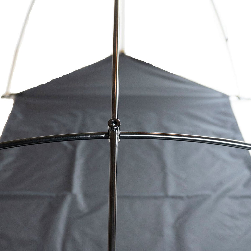 Full-length pole system holding Dominator bedroll canvas off sleeping area